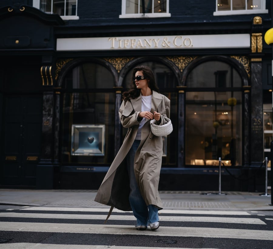 Beige Trench Coat with Blue Jeans and Silver Sneakers Beige Trench Coat with Blue Jeans and Silver Sneakers — Trendy Luxury Outfits