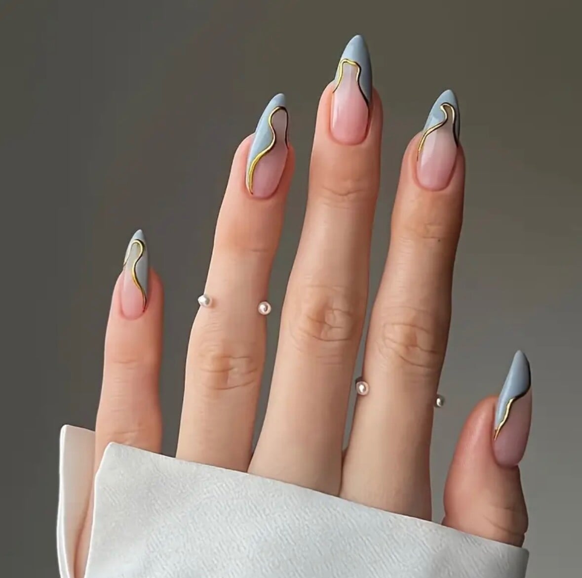 Light Blue French with Gold Lines Medium Almond Nails — Trendy Medium Almond Nails