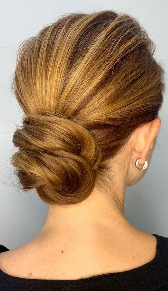 Sophisticated Low Bun With Smooth Texture — Trendy Messy Bun Updo
