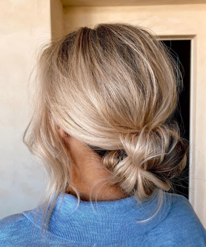Messy Low Bun With Darker Roots — Trendy Messy Bun Updo