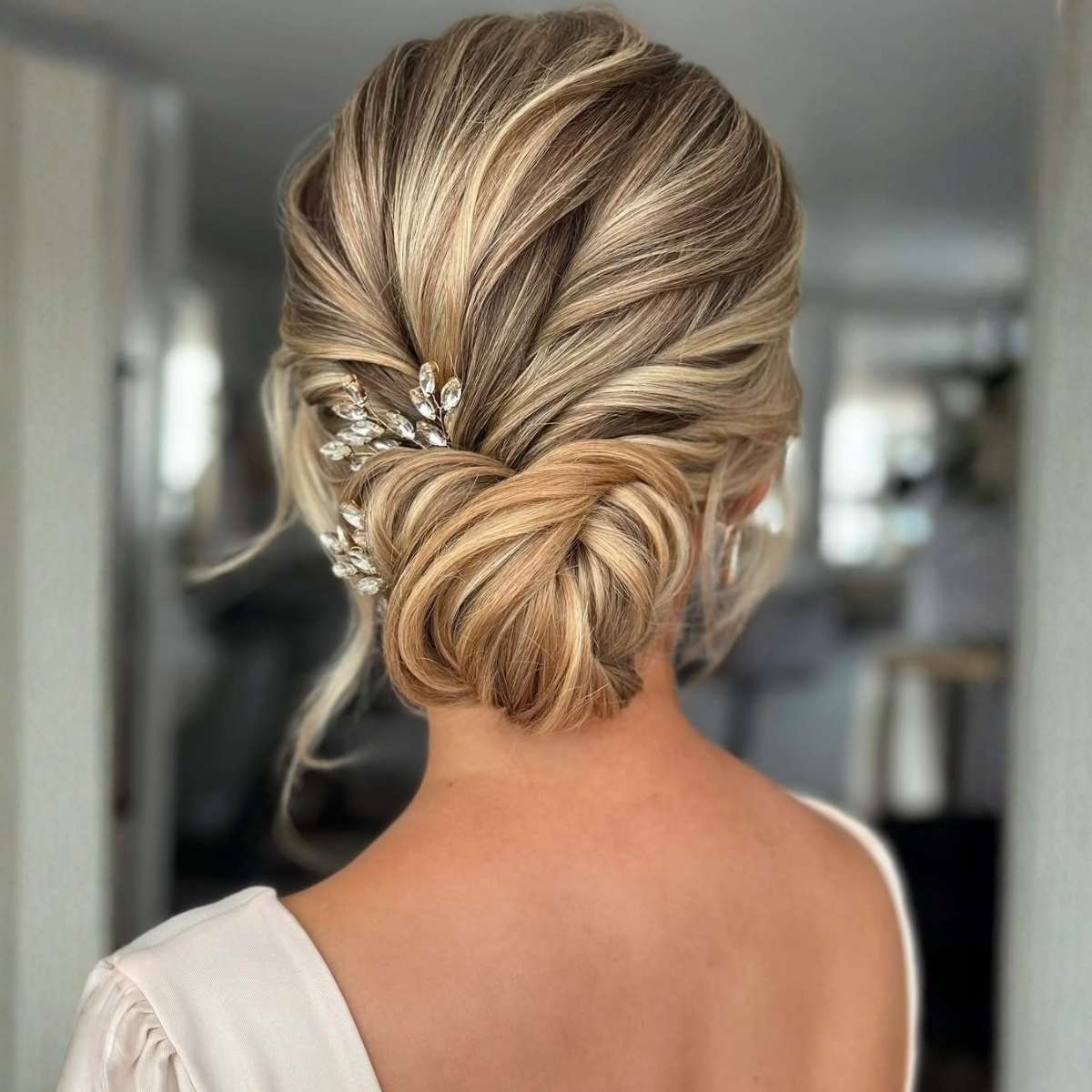 Polished Low Bun With Balayage — Trendy Messy Bun Updo