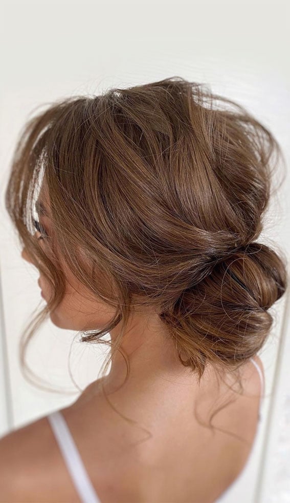 Medium Brown Low Bun With Wispy Bangs — Trendy Messy Hair