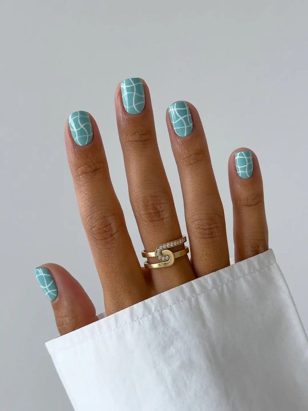 Teal With White Geometric Lines Oval Nails — Trendy Minimal Nails
