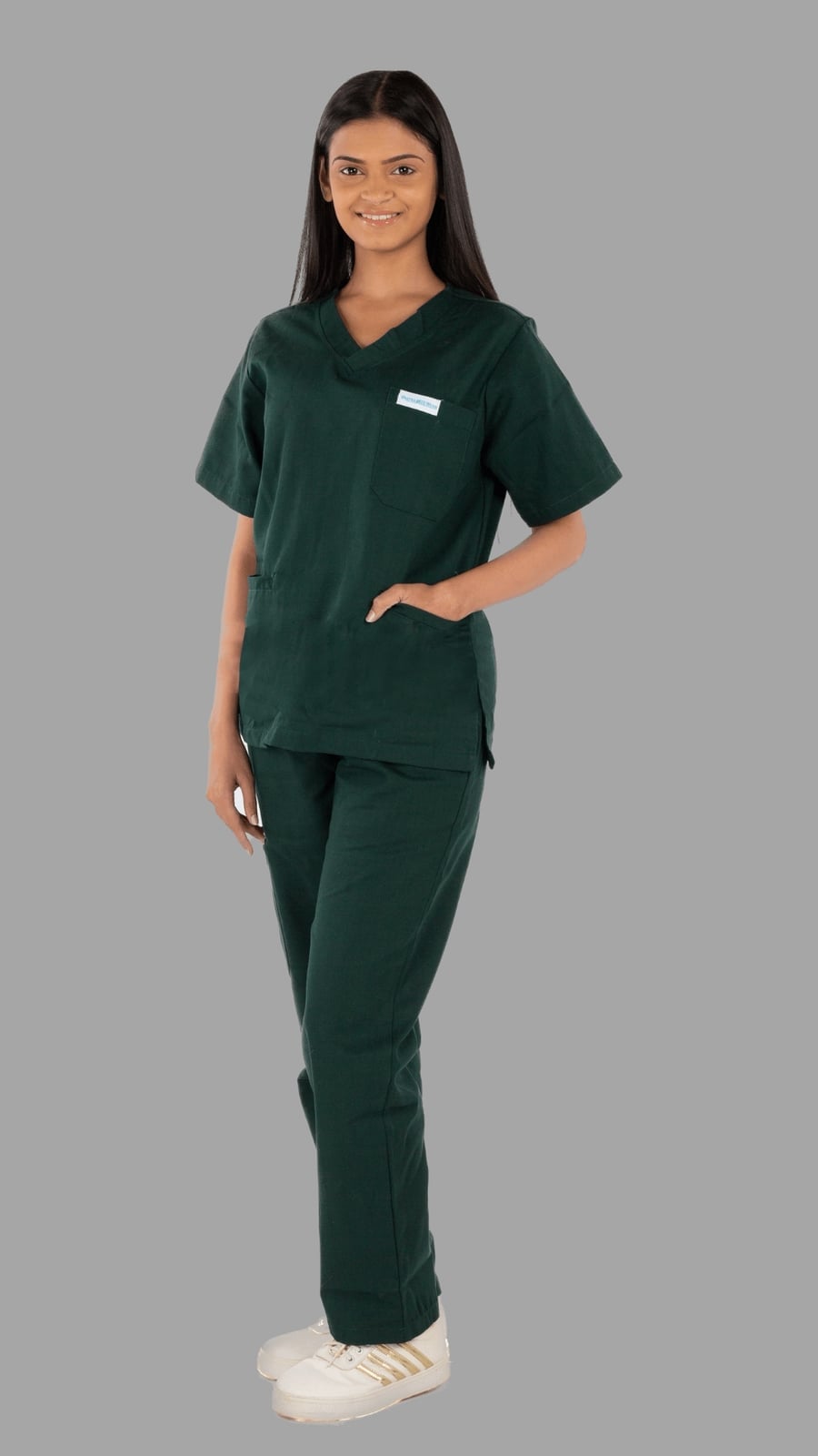 Dark Green V-neck Scrub Set with White Sneakers and Performance Fabric — Trendy Nurse Outfits