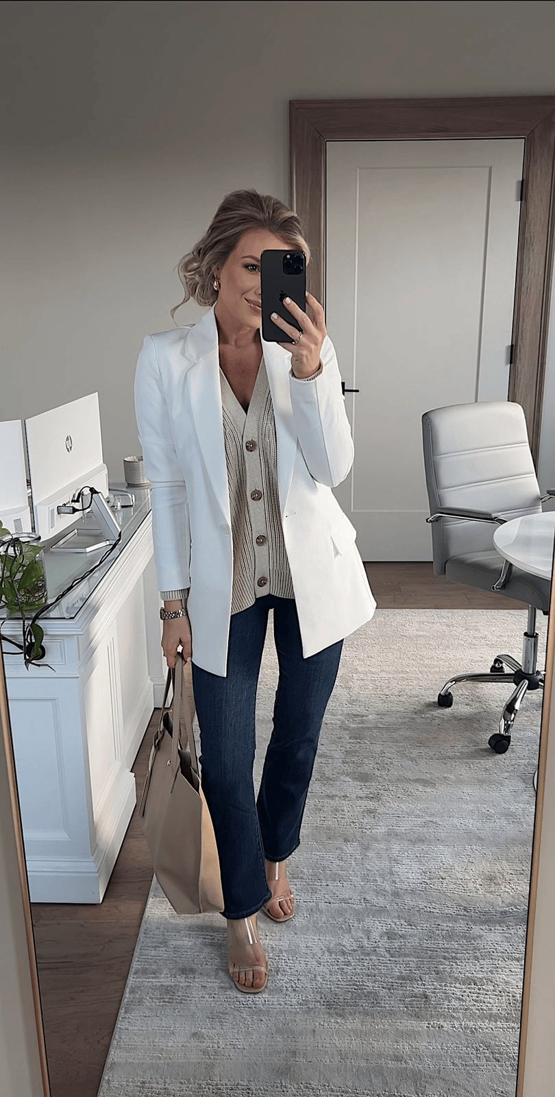 White Blazer Over Beige Cardigan and Blue Jeans White Blazer Over Beige Cardigan and Blue Jeans — Trendy Office Outfits
