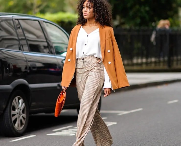 Burnt Orange Blazer Draped Over Plaid Trousers Burnt Orange Blazer Draped Over Plaid Trousers — Trendy Office Outfits