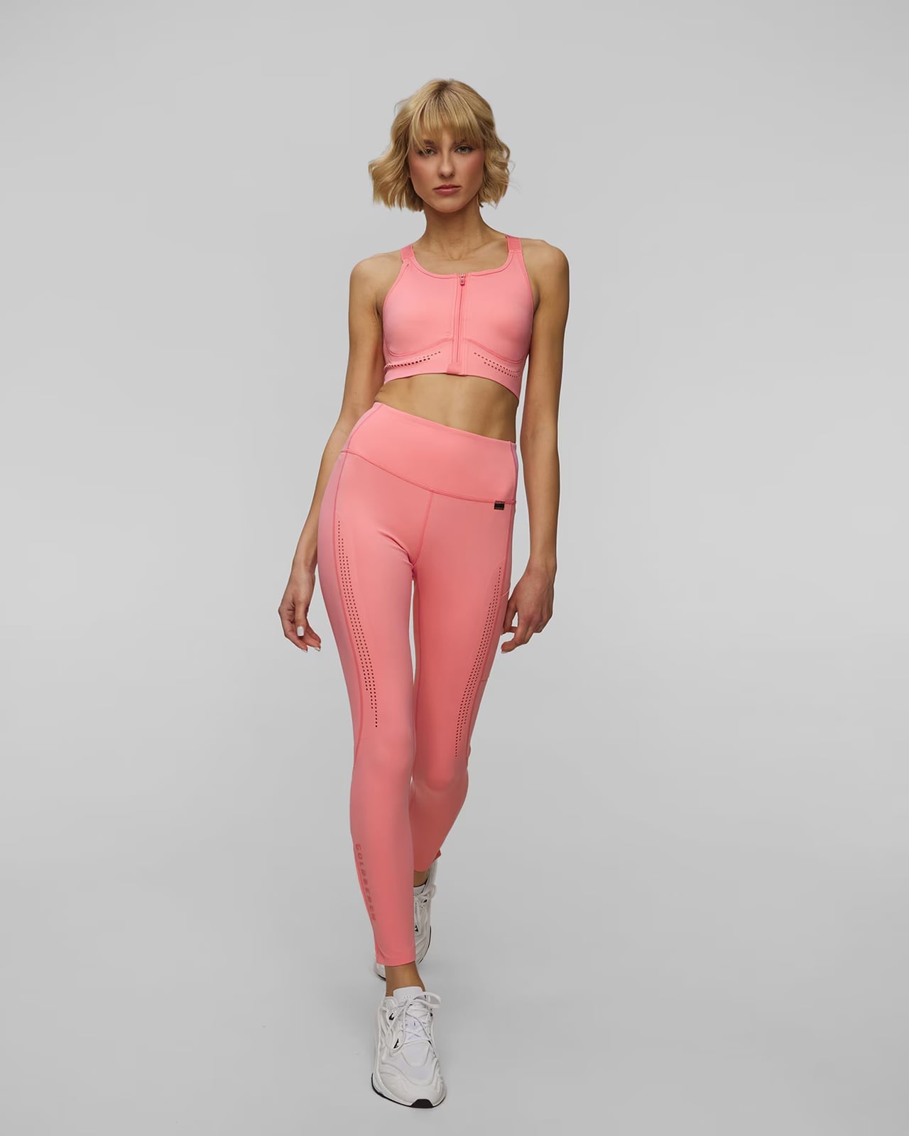 Bright Pink Perforated Leggings and Zip-Up Sports Bra Bright Pink Perforated Leggings and Zip-Up Sports Bra — Trendy Pink Leggings Outfit