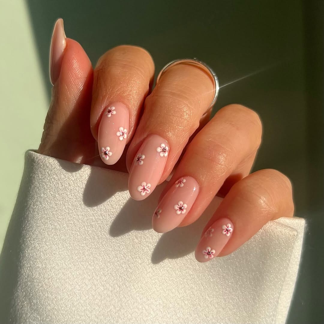 Translucent Pink Nails With Small Floral Design — Trendy Pink Nails