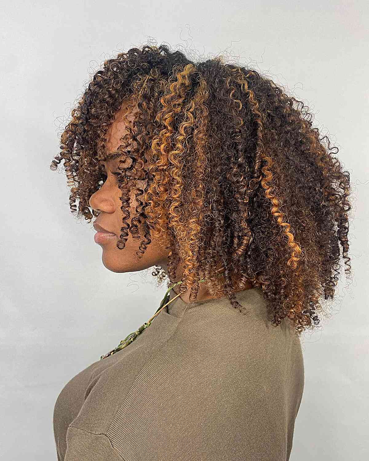 Brown Crewneck Sweater With Curly Weave Hairstyle — Trendy Quick Weave
