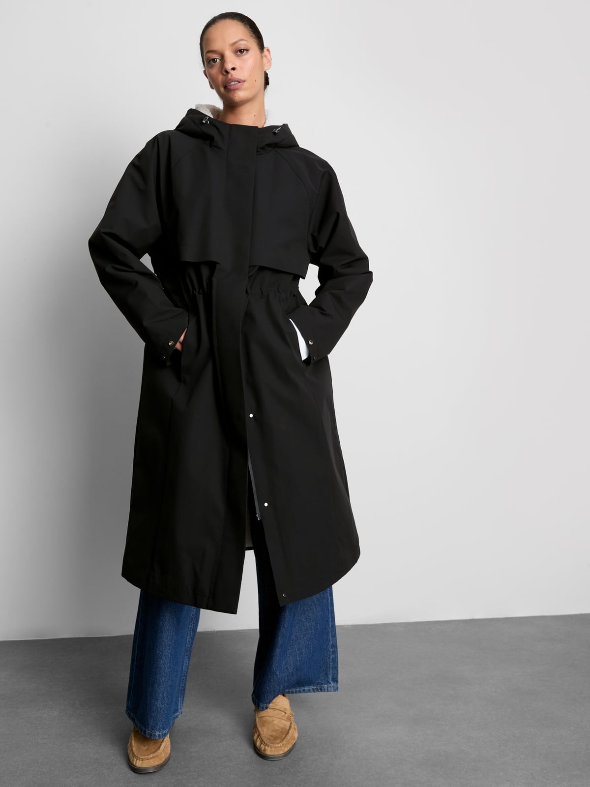 Black Technical Jacket With Cinched Waist — Trendy Rain Jacket Outfits