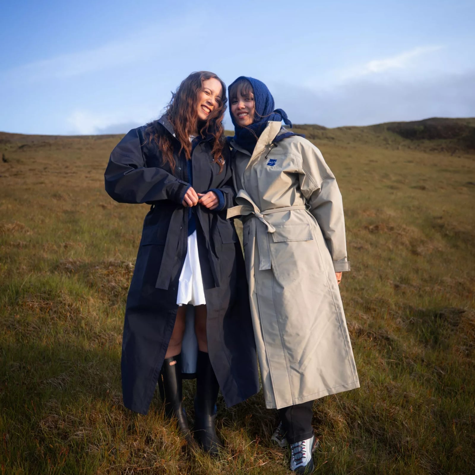 Navy Rain Jacket Over White Dress — Trendy Rain Jacket Outfits