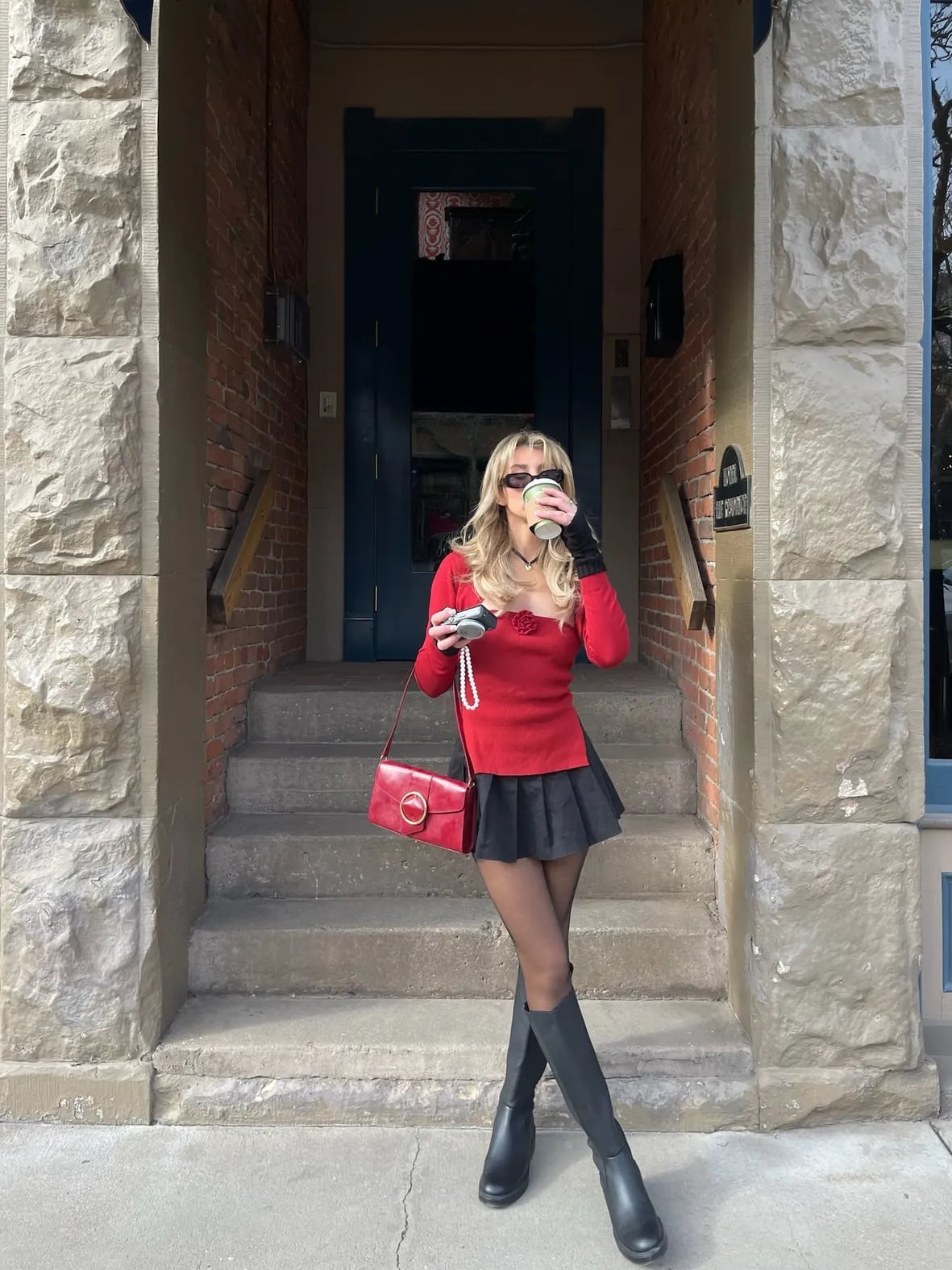 Red Long-Sleeve Top With Black Skirt and Knee-High Boots — Trendy Red Sweater Outfit