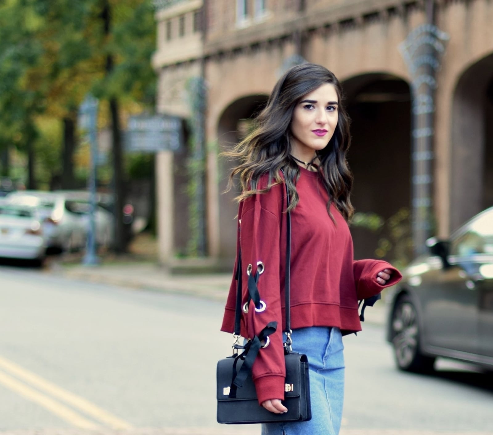 Red Sweatshirt With Lace-Up Sleeves and Denim Skirt — Trendy Red Sweater Outfit