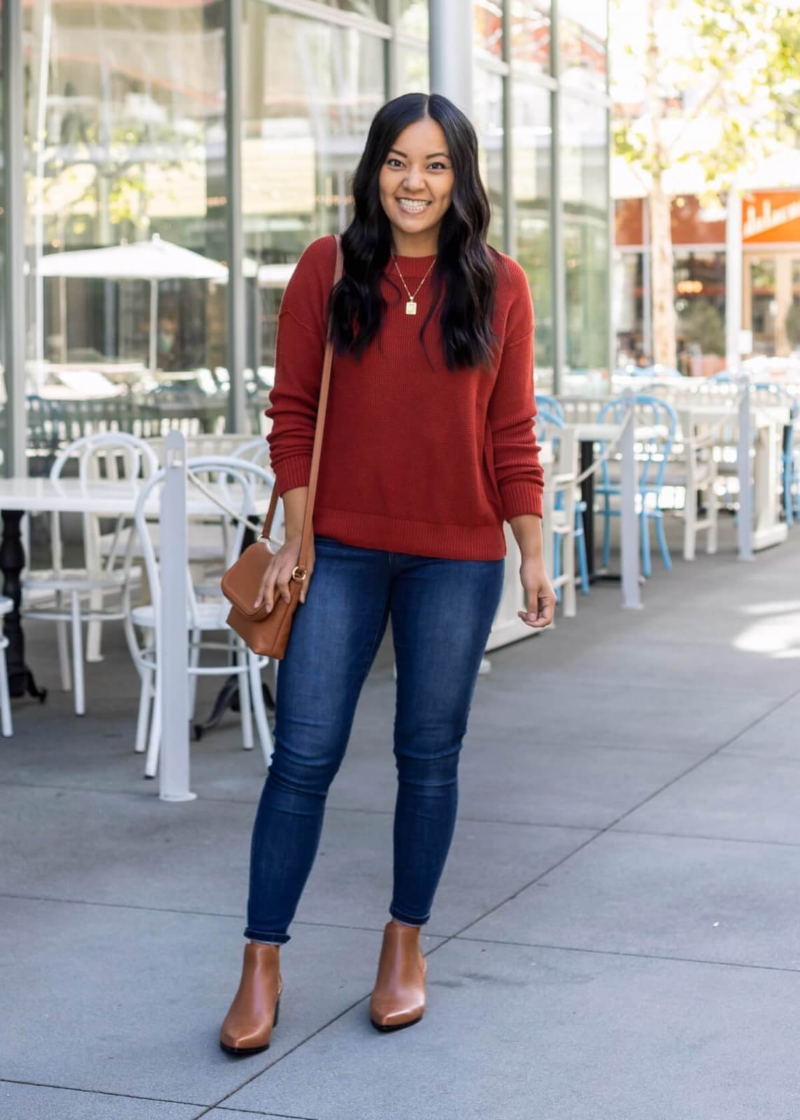 Burnt Red Waffle Knit Sweater With Blue Jeans and Tan Bag — Trendy Red Sweater Outfit