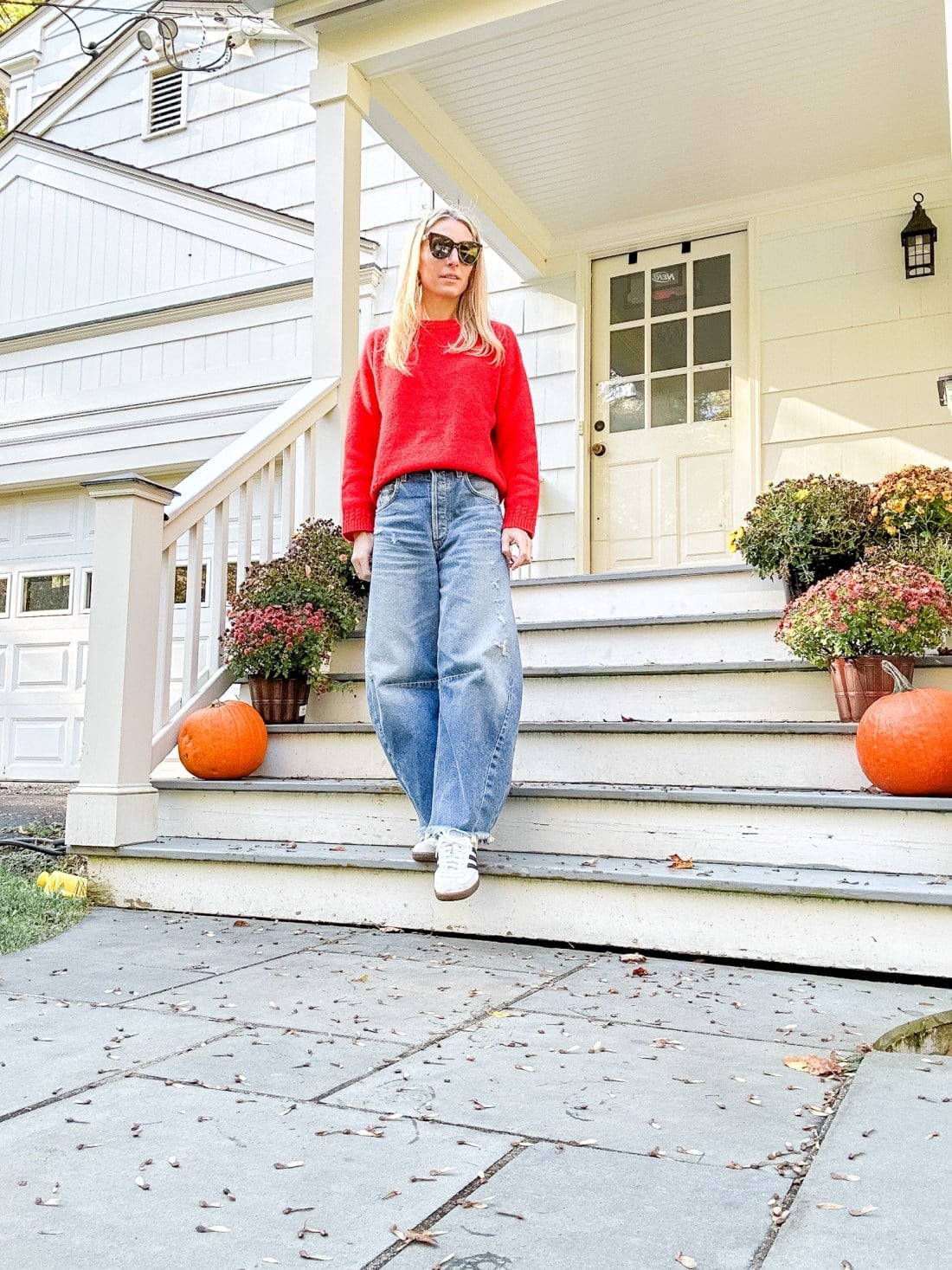 Red Crewneck Sweater With Blue Wide-Leg Jeans and White Sneakers — Trendy Red Sweater Outfit