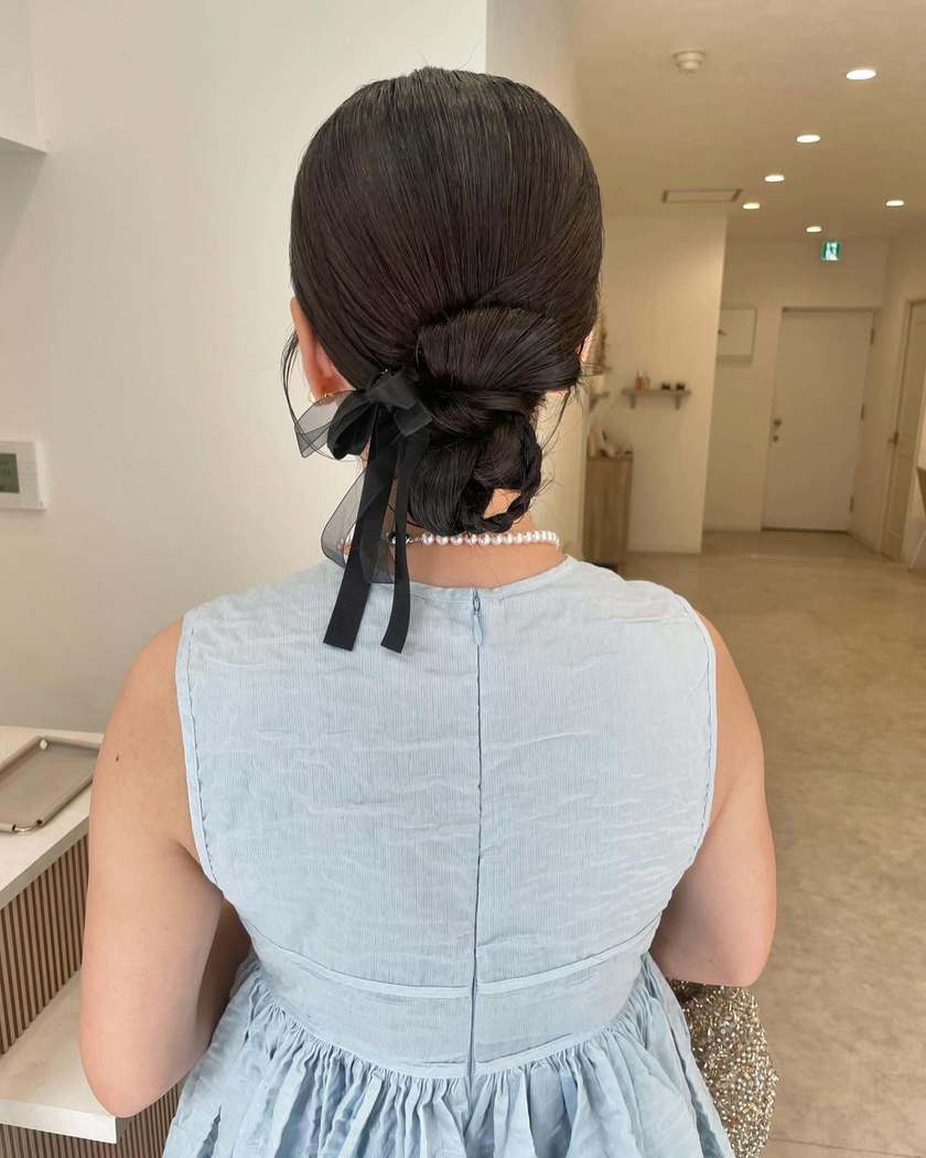Neck Length Dark Brown Bun With Ribbon Bow — Trendy Ribbon Hair
