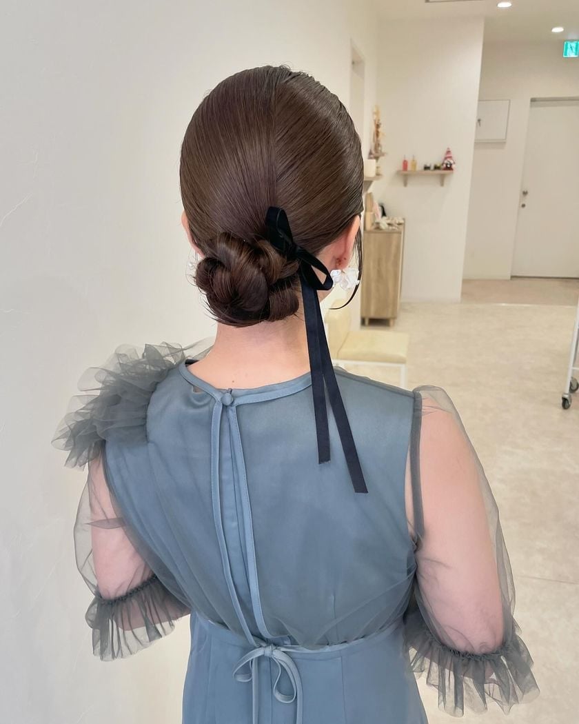 Sleek Dark Brown Low Bun With Velvet Ribbon — Trendy Ribbon Hair