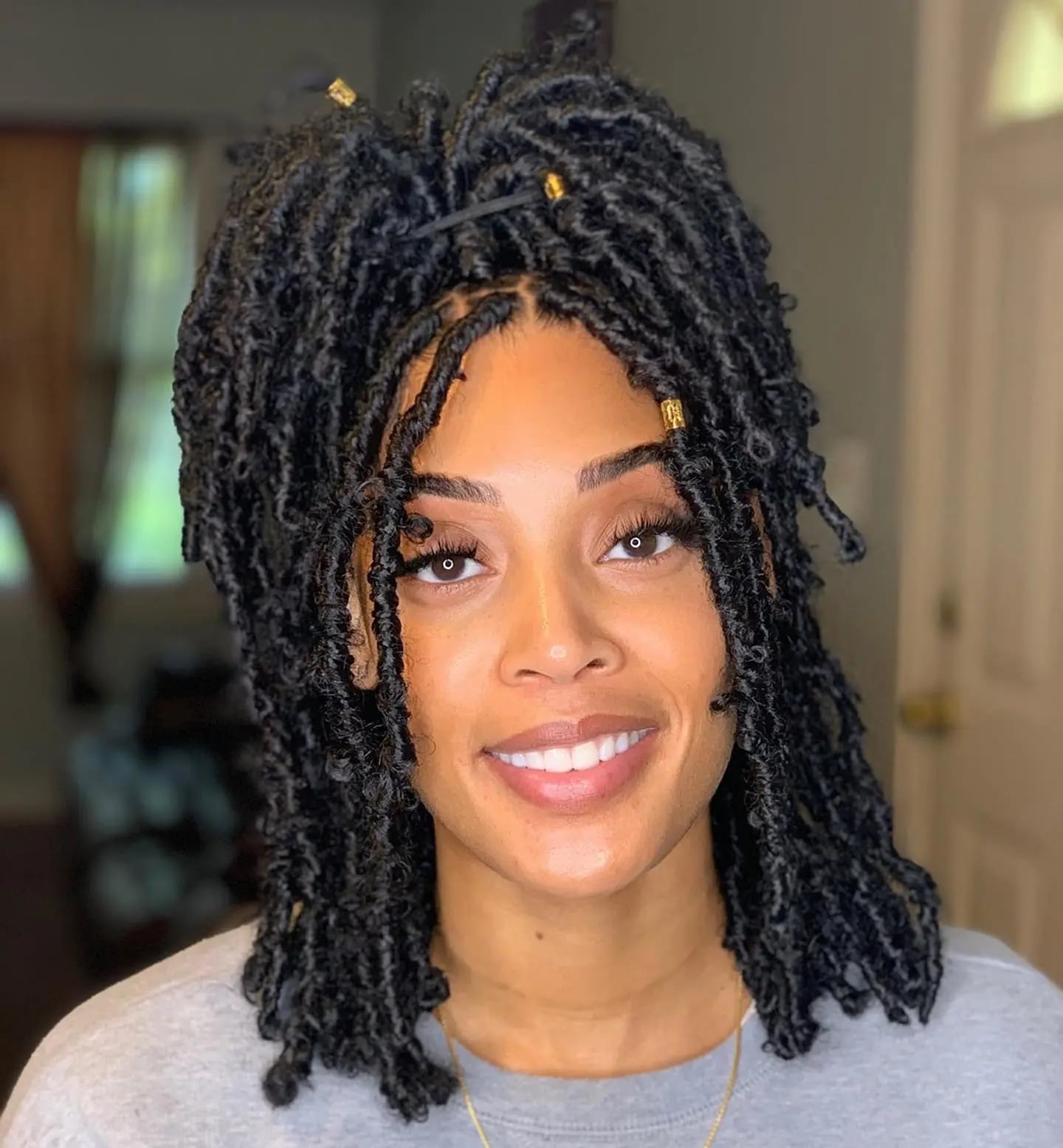 Faux Locs Updo With Golden Beads — Trendy Short Locs