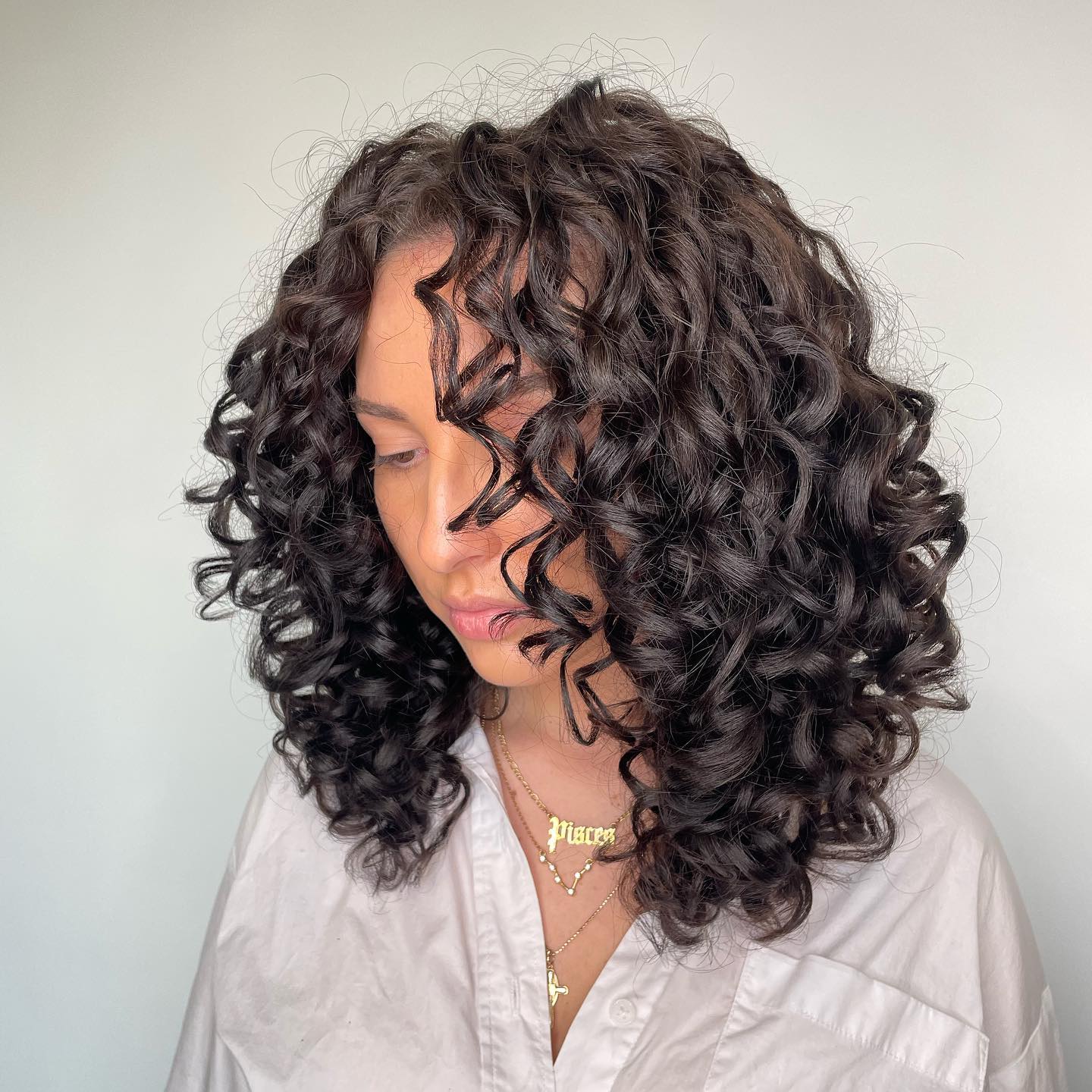 Collarbone Curls With Defined Texture, Layers — Trendy Shoulder Length Curly Hair