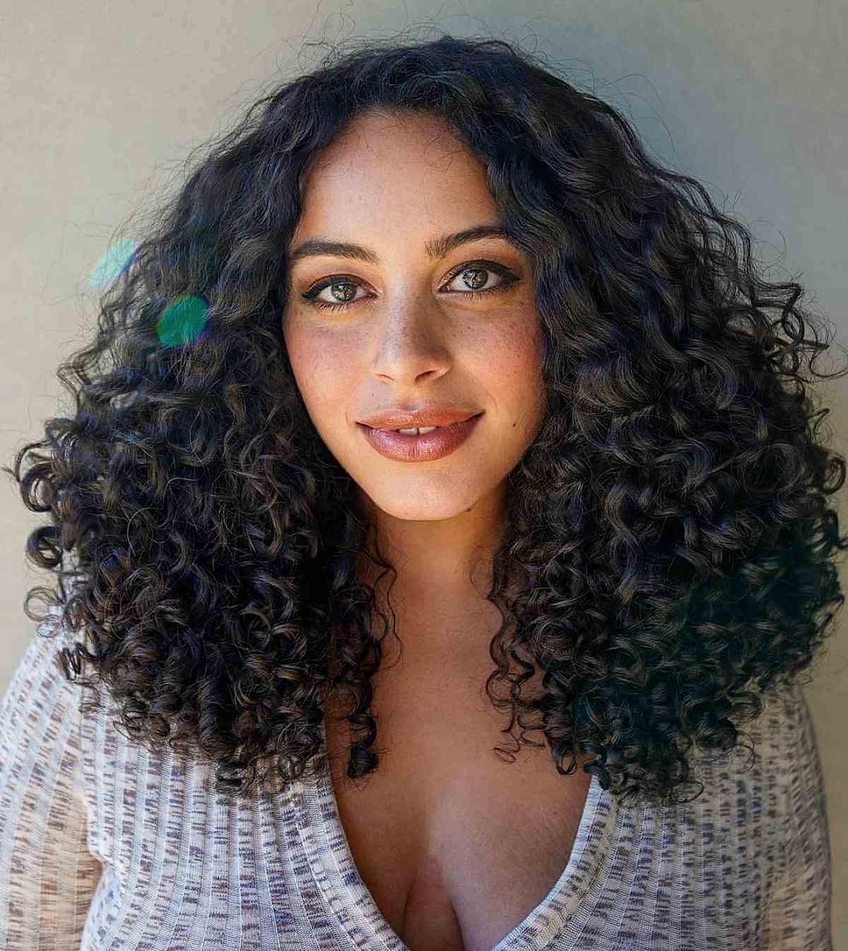 Shoulder Length Thick Curls With Subtle Highlights — Trendy Shoulder Length Curly Hair