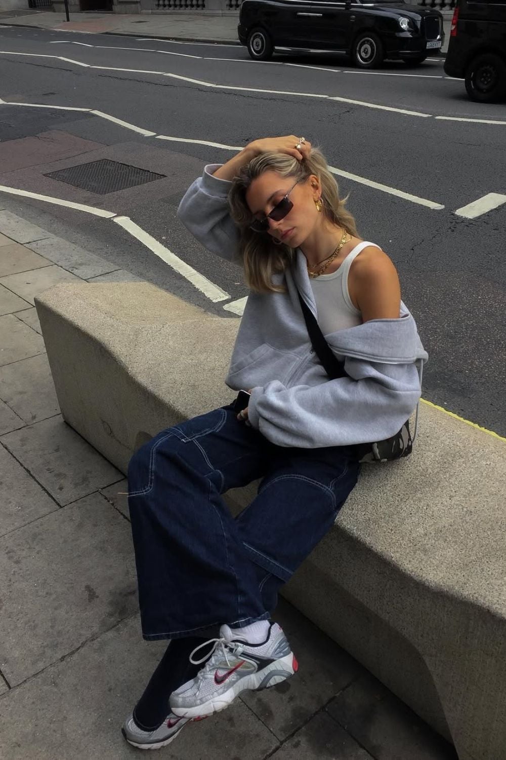 Grey Hoodie Over White Tank with Baggy Dark Wash Jeans — Trendy Skater Outfits