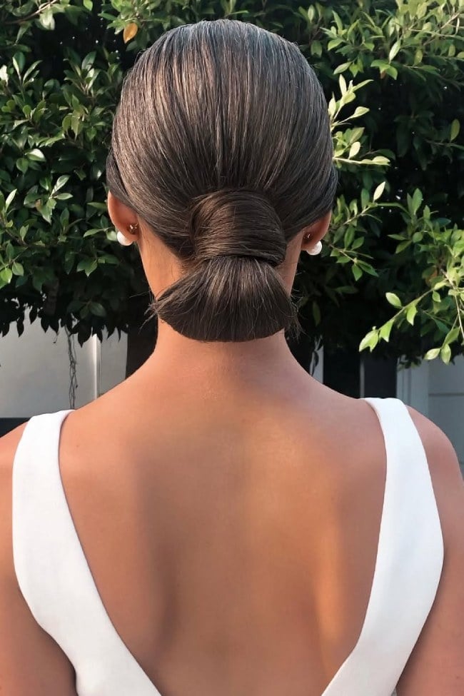 Dark Brown Slicked Back High Bun — Trendy Sleek Hairstyles