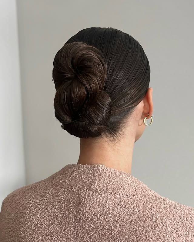 Intricate Dark Brown Slicked Back Bun — Trendy Slick Back Hairstyles