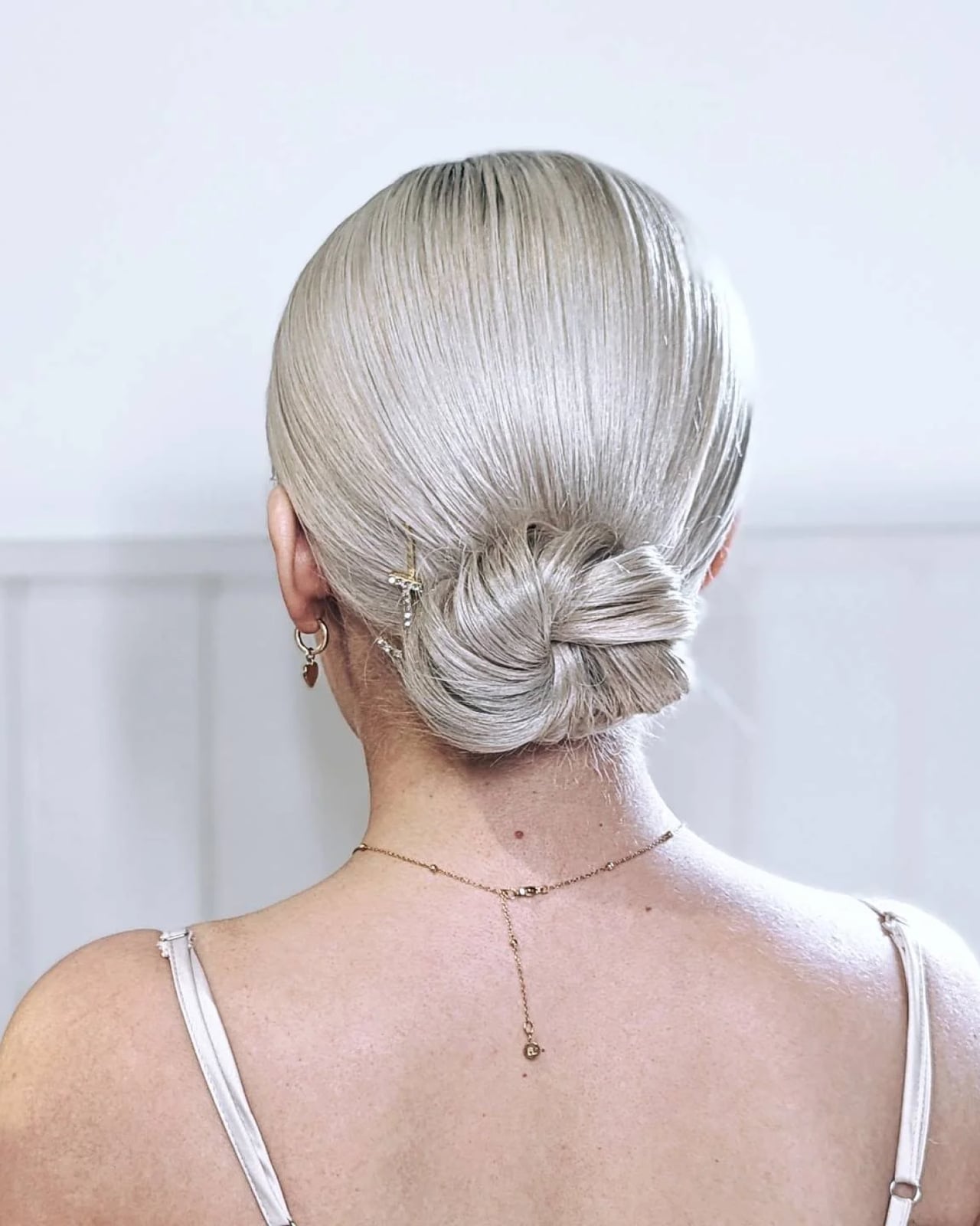 Ash Blonde Long Slicked Back Bun — Trendy Slick Back Hairstyles