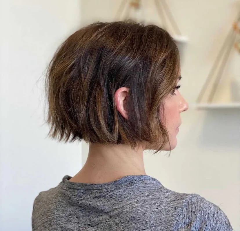 Short Bob With Blunt Bangs and The Side View Highlights The Sharp — Trendy Soccer Hair