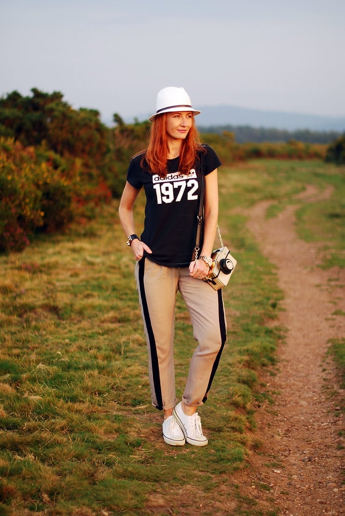 Graphic T-shirt With Striped Track Pants — Trendy Sporty Outfits