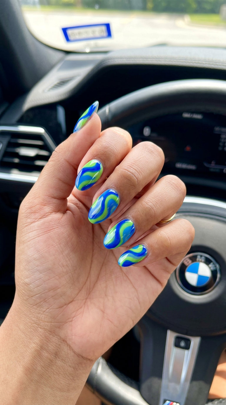 Abstract Swirls Cobalt & Lime Nails 2026 Abstract swirls cobalt and lime nails for festivals or statement manicures. Trendy summer nails 2026.