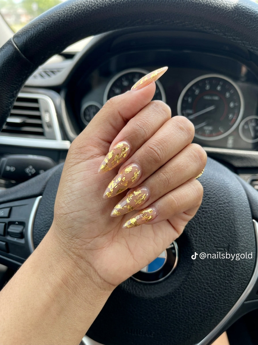 Gold Foil Stiletto Nails 2026: Glamorous Party Look Metallic Gold Foil Flakes Stiletto nails: glamorous, edgy trendy summer nails 2026 for parties.