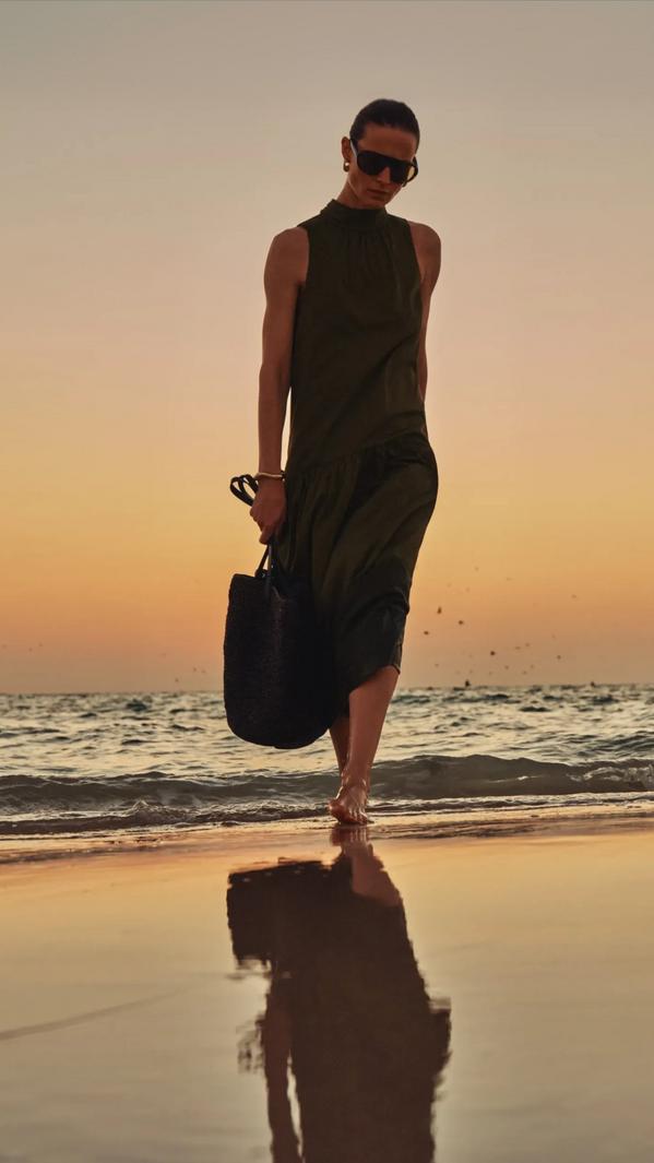 Olive Green Sleeveless Midi Dress on Beach — Trendy Sunset Outfit