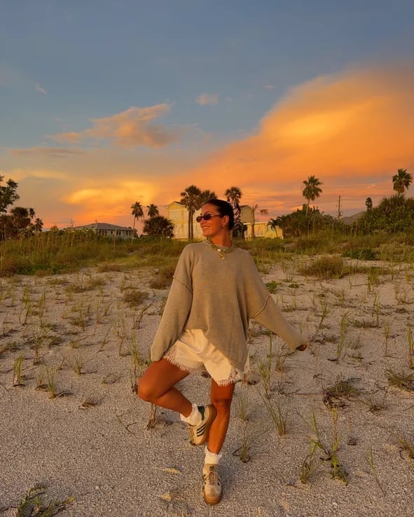 Grey Knit Sweater Over White Denim Shorts — Trendy Sunset Outfit