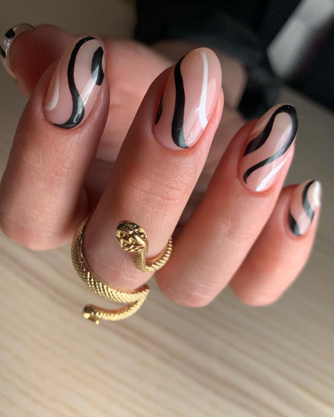 Bold Black and White Swirls on Sheer Nude — Trendy Swirl Nails