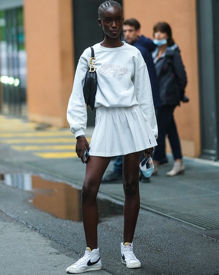 Oversized White Sweatshirt and White Pleated Mini Skirt, Close-Up Take — Trendy Tennis Outfits