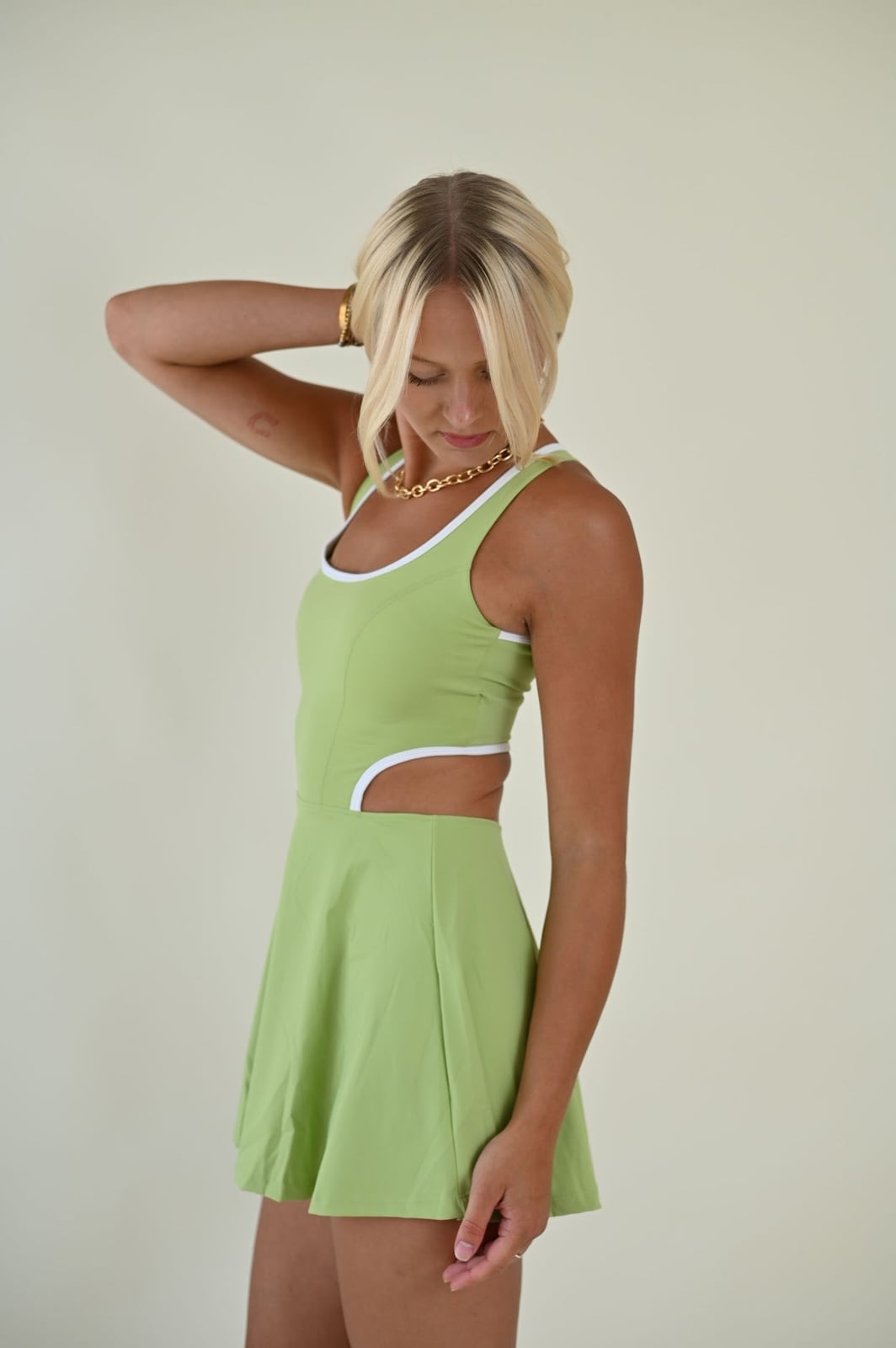Lime Green Tennis Dress with White Trim and Side Cut-Outs — Trendy Tennis Outfits