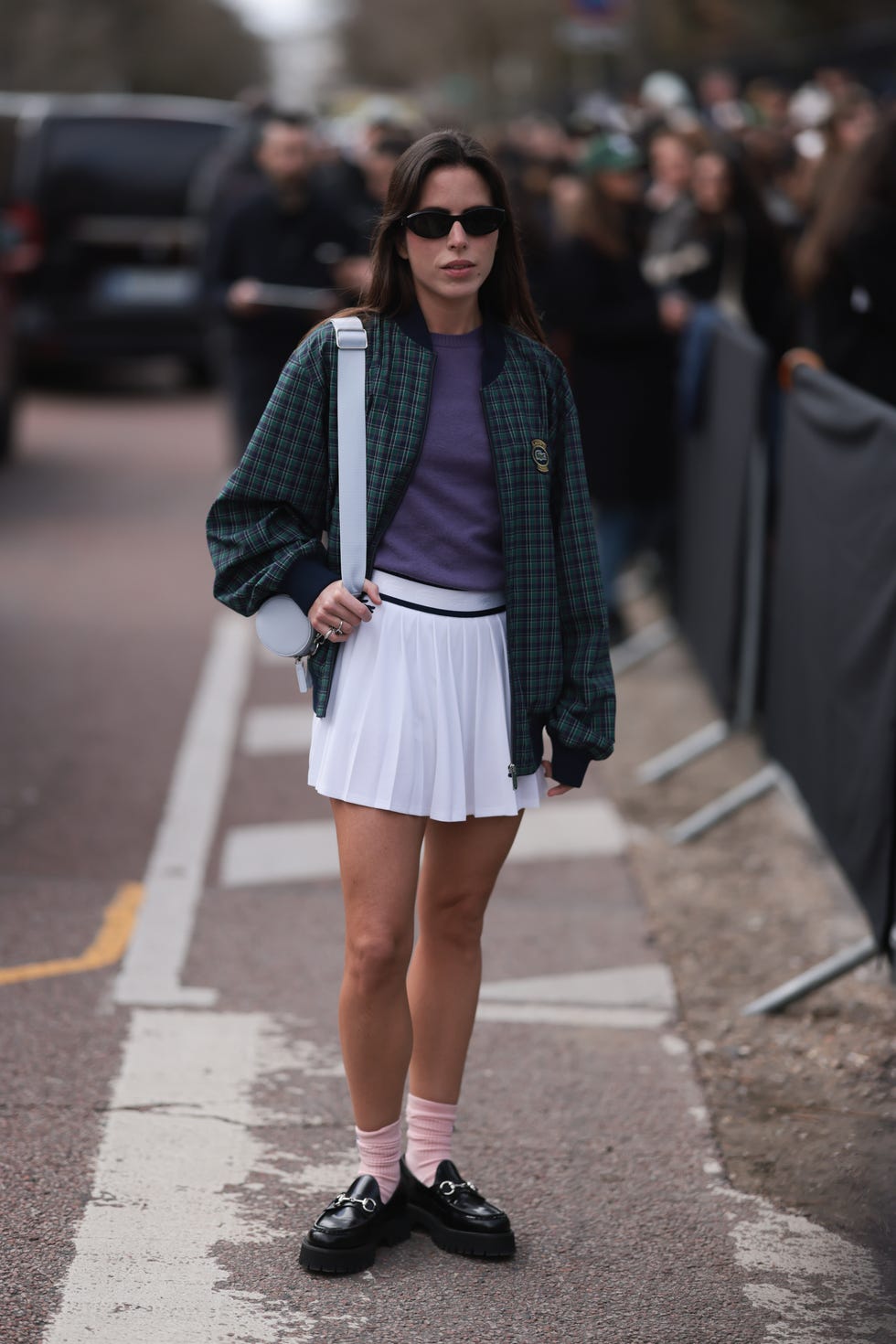 Green Plaid Bomber Jacket Over Sweater and Pleated Skirt — Trendy Tennis Outfits