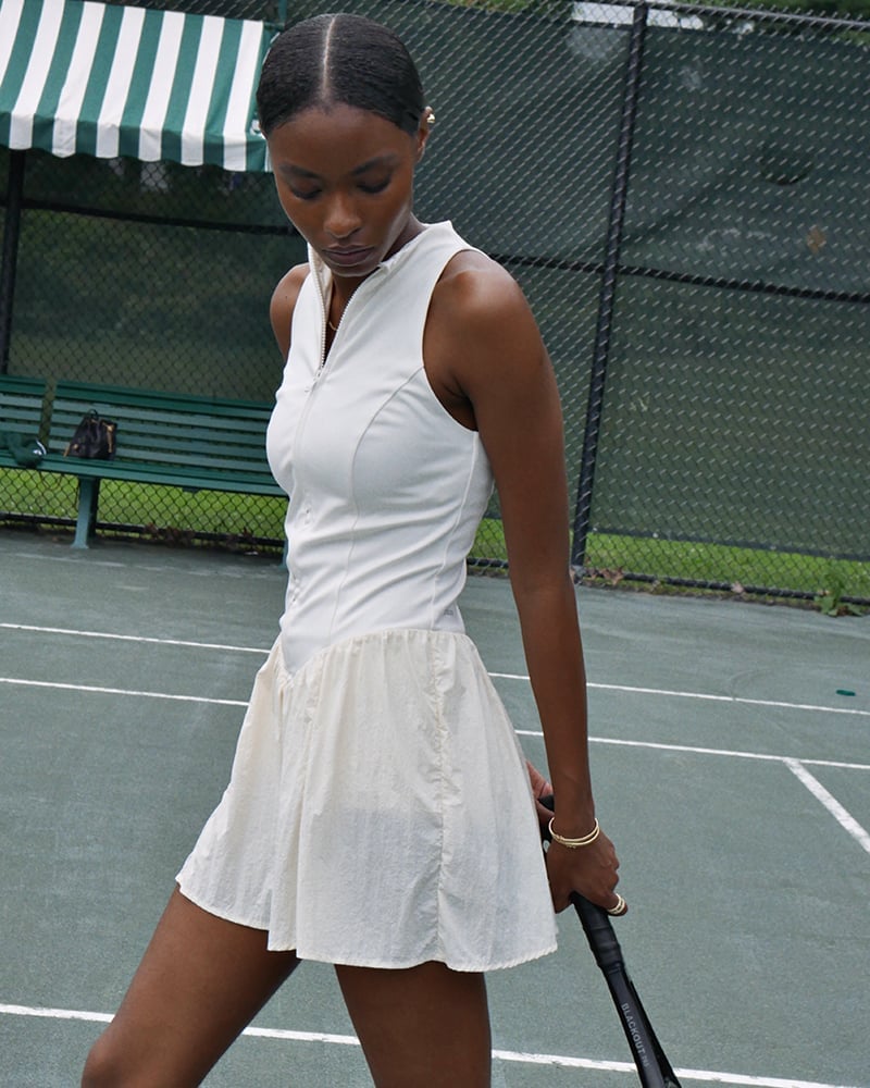 Off-white Sleeveless Tennis Dress with Textured Skirt — Trendy Tennis Outfits