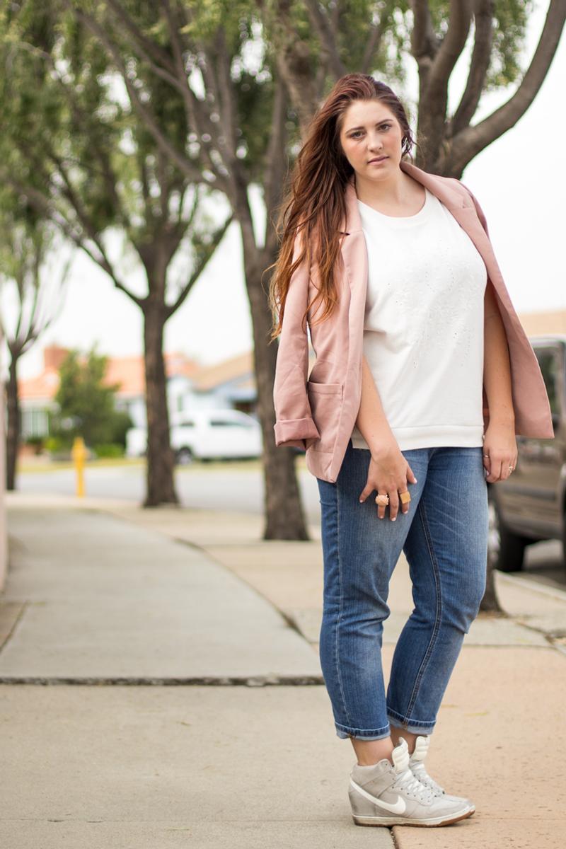 Pink Blazer Draped Over Shoulders with Jeans — Trendy Tomboy Outfits