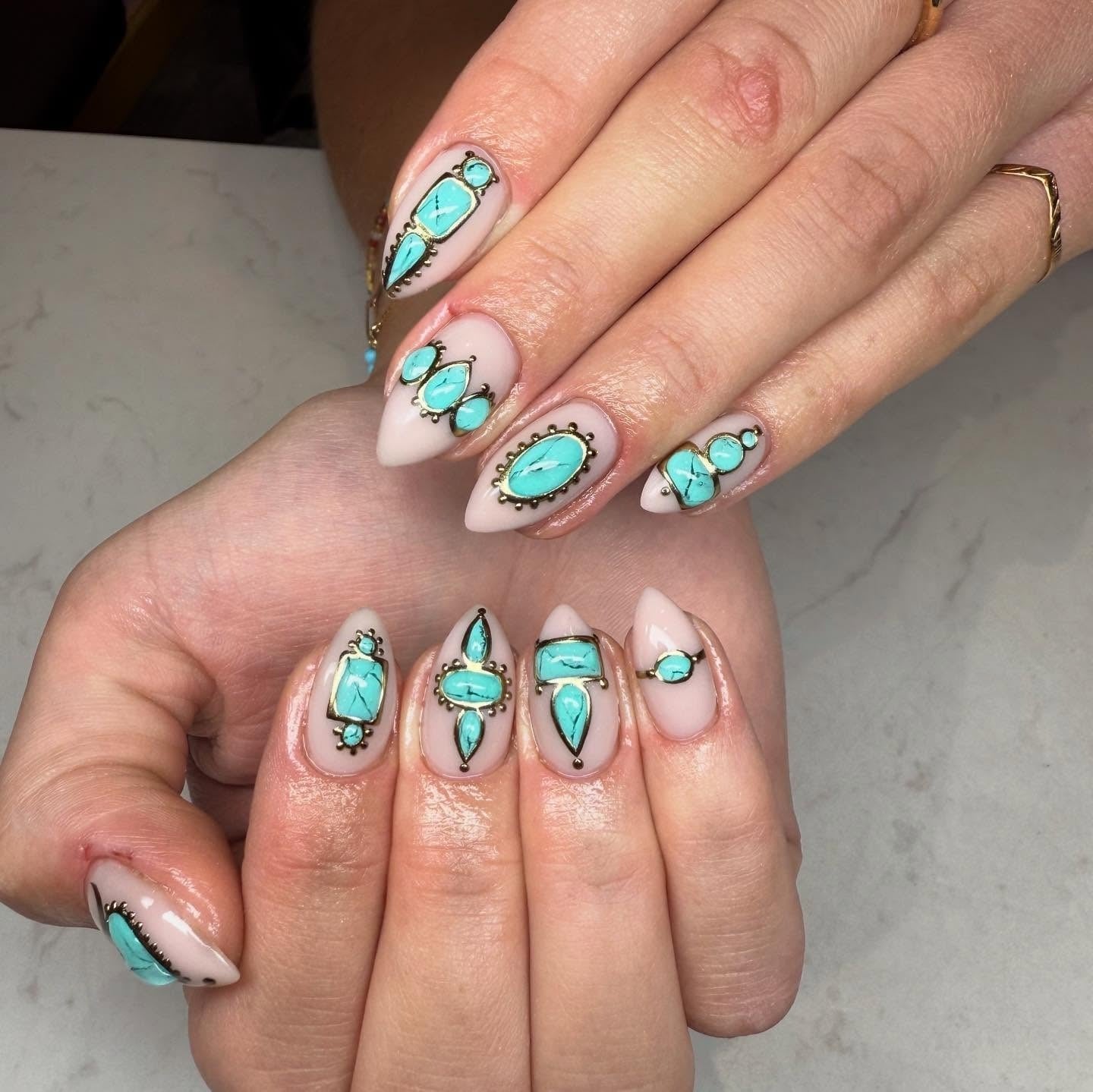 Nude Base 3D Turquoise Stone Gold Outline Almond Nails Nude Base 3D Turquoise Stone Gold Outline Almond Nails — Trendy Turquoise Nails