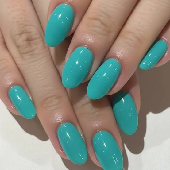 Bright Turquoise Glossy Short Almond Nails, Close-Up Take Bright Turquoise Glossy Short Almond Nails, Close-Up Take — Trendy Turquoise Nails