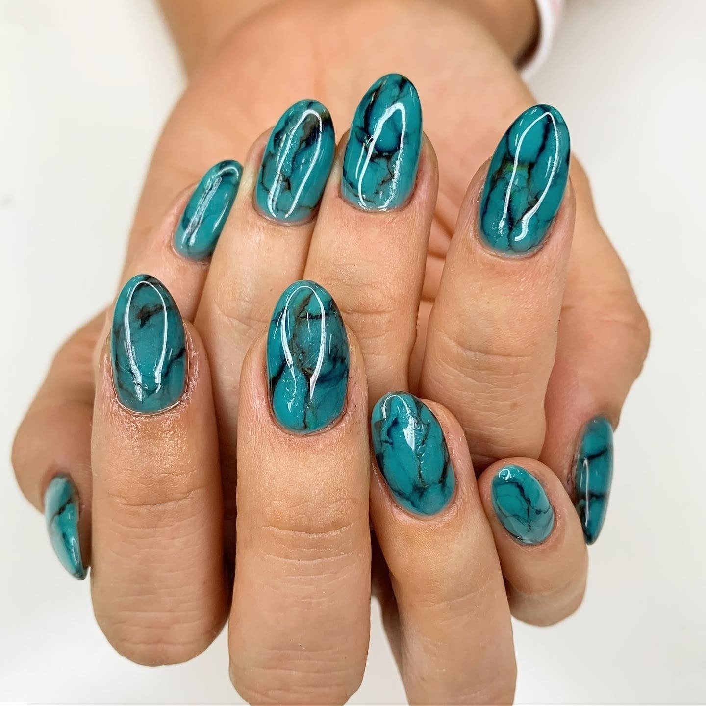 Realistic Turquoise Stone Pattern Glossy Oval Nails Realistic Turquoise Stone Pattern Glossy Oval Nails — Trendy Turquoise Nails