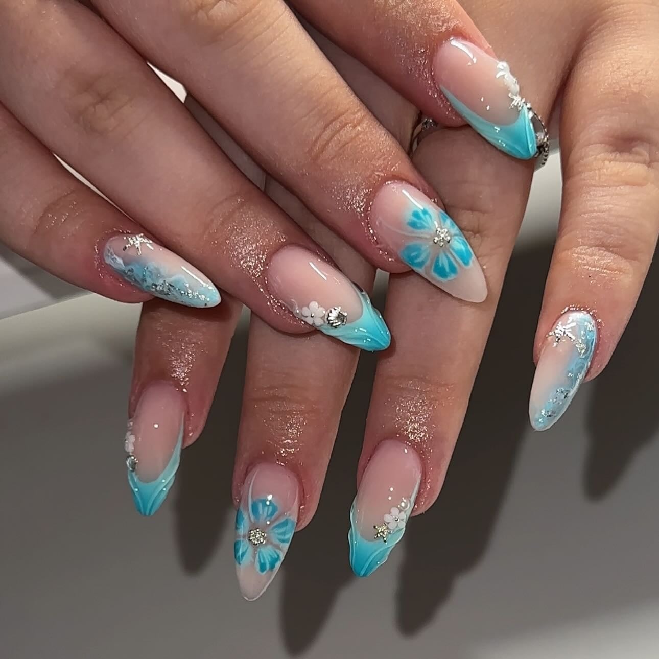 Long Almond Floral Rhinestone Turquoise French Tip Nails Long Almond Floral Rhinestone Turquoise French Tip Nails — Trendy Turquoise Nails