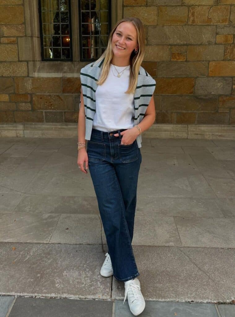 Striped Sweater Vest and Straight Leg Jeans With White Sneakers — Trendy Uni Outfits