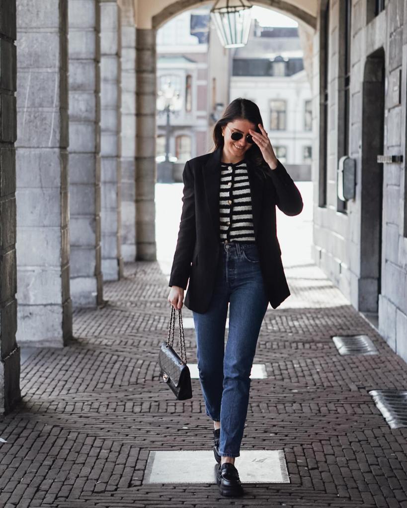 Black Blazer with Striped Knit Top and Straight Leg Jeans — Trendy Uni Outfits