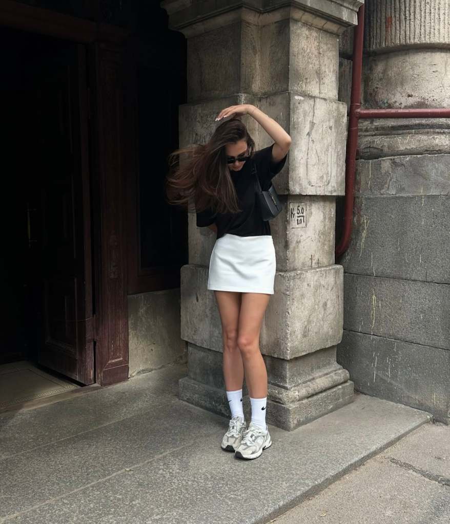 Black T-Shirt with White Mini Skirt and Chunky Sneakers — Trendy Uni Outfits