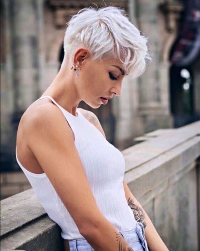 Edgy Platinum Pixie With Swept Micro Bangs and Styled With Texture Edgy Platinum Pixie With Swept Micro Bangs and Styled With Texture — Trendy Very Short Hair