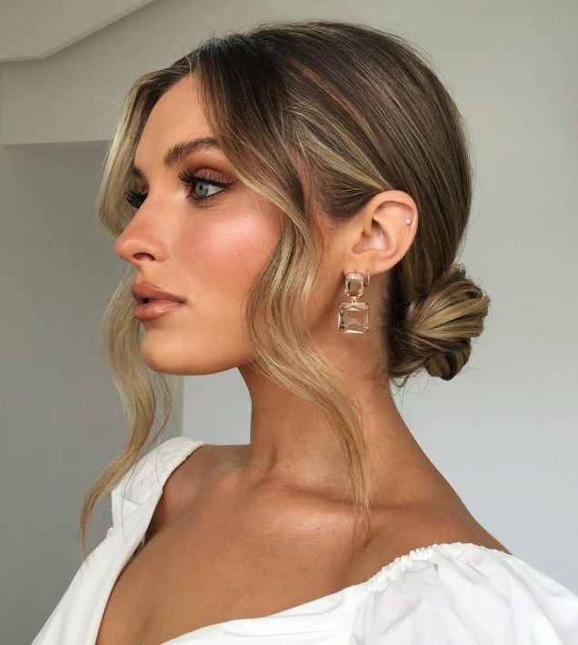 Loose Low Bun With Soft Face-Framing Pieces Loose Low Bun With Soft Face-Framing Pieces — Trendy Wedding Guest Updos