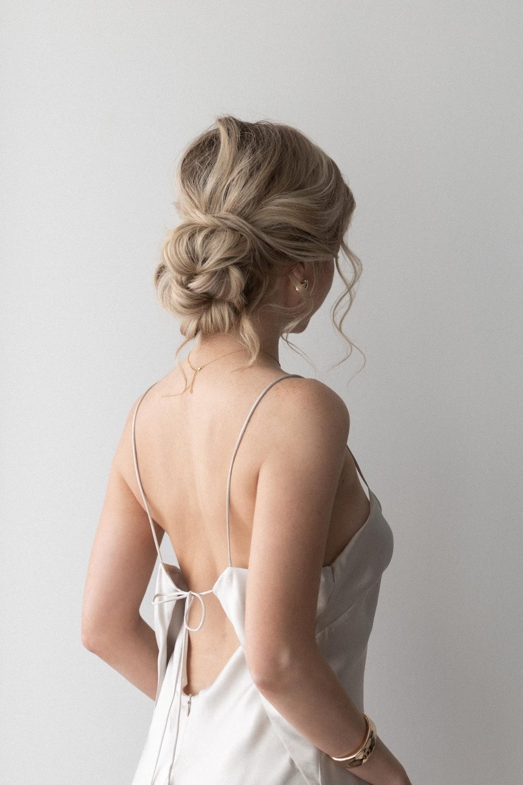 Effortlessly Chic Messy Low Updo Effortlessly Chic Messy Low Updo — Trendy Wedding Guest Updos
